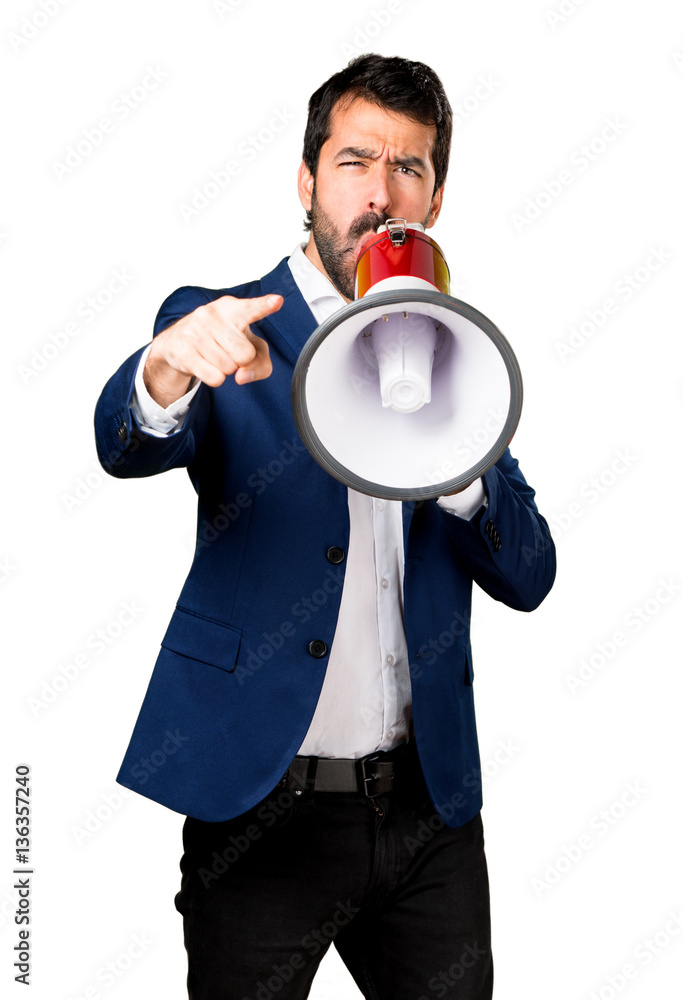 Handsome man shouting by megaphone Handsome man shouting by megaphone