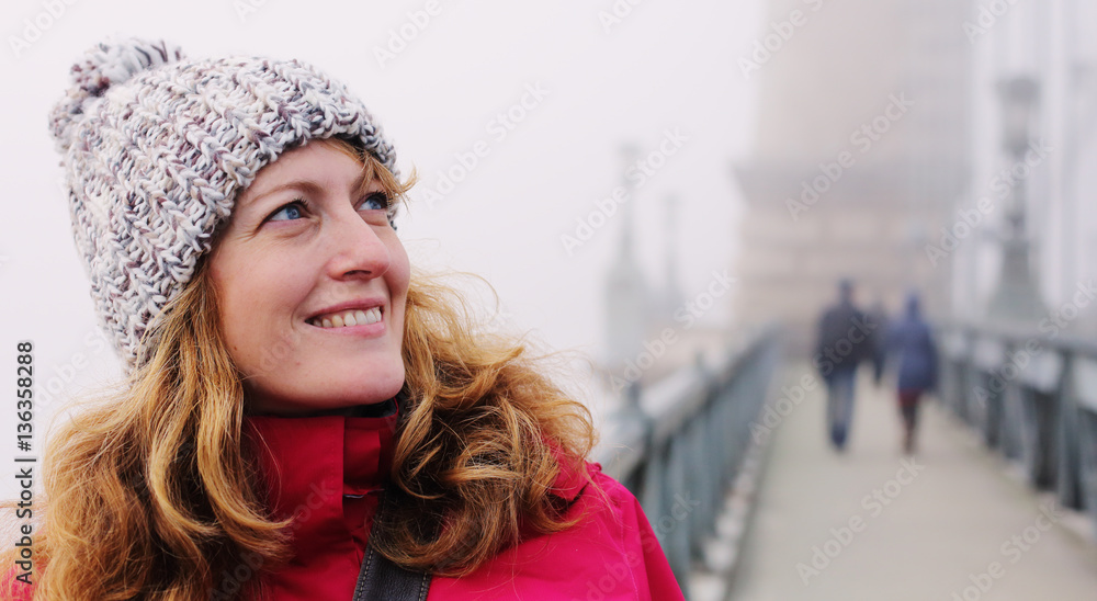 Outdoors portrait of happy woman walking on Budapest Outdoors portrait of happy woman walking on Budapest