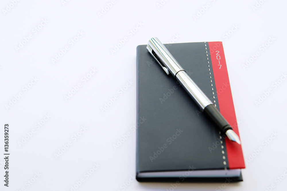 notepad for year 2017 with fountain pen. Man plans 14 February notepad for year 2017 with fountain pen. Man plans 14 February