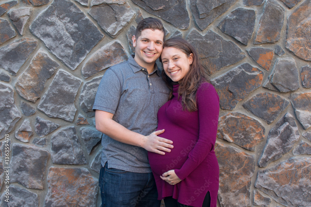 Portrait of man and pregnant women  Man and pregnant women standing outside for a maternity portrait