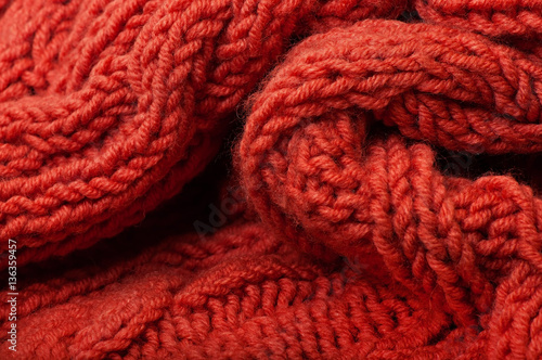 Background of red knitted fabric.