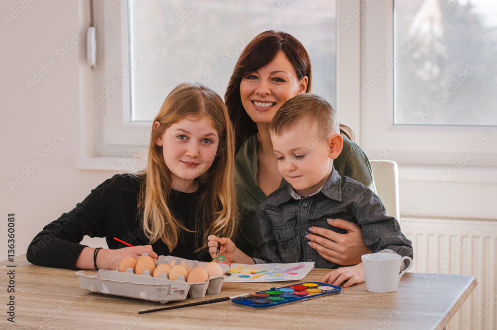 Happy family mother and two children preparing for Easter. Happy family mother and two children preparing for Easter.