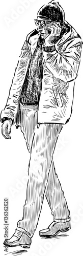 casual pedestrian with a mobile phone