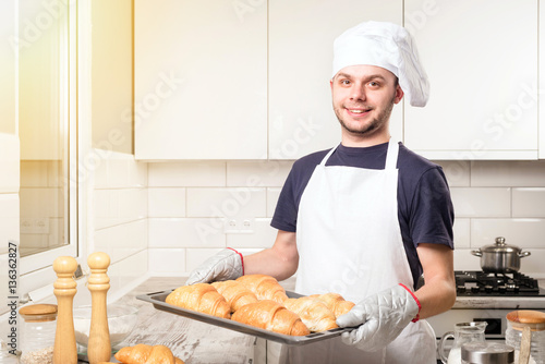 baker showing croissant