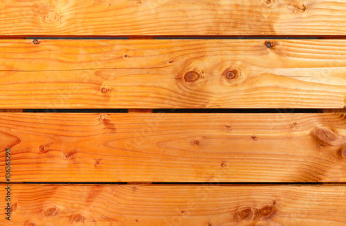Background of orange oiled wooden planks