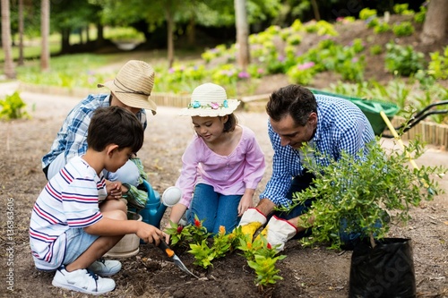 Happy family gardening together