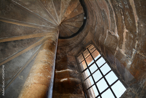 Old stone stairs up in tower of Saint Mary of Valencia Metropolitan Basilica Cathedral, Spain.