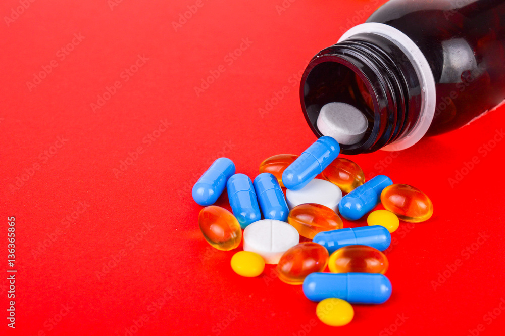 Various pills and bottle on bright background Various pills and bottle on bright background