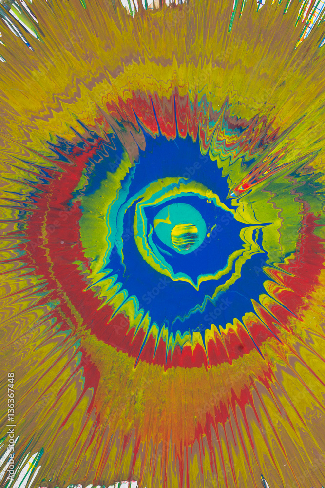 Yellow and red spray paint on a cardboard