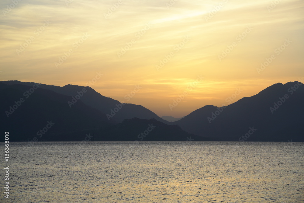Scenic sunrise over the mountainous coast of the Mediterranean sea