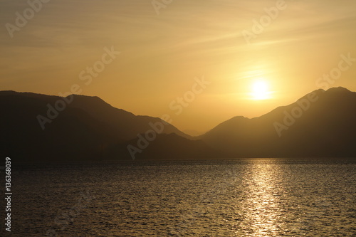 Scenic sunrise over the mountainous coast of the Mediterranean sea © Vitalii Makarov