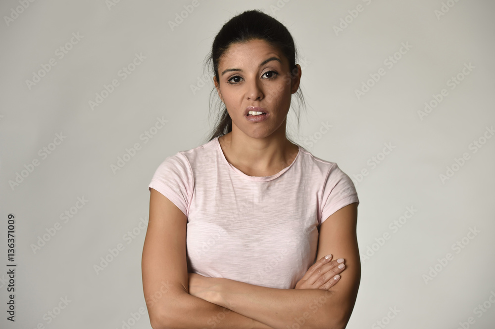 beautiful arrogant and moody spanish woman showing negative feeling and contempt facial expression beautiful arrogant and moody spanish woman showing negative feeling and contempt facial expression