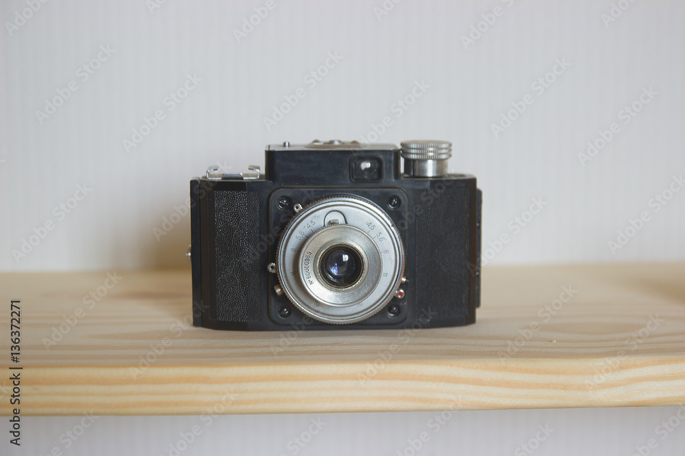 Old photo camera objective with low depth of field