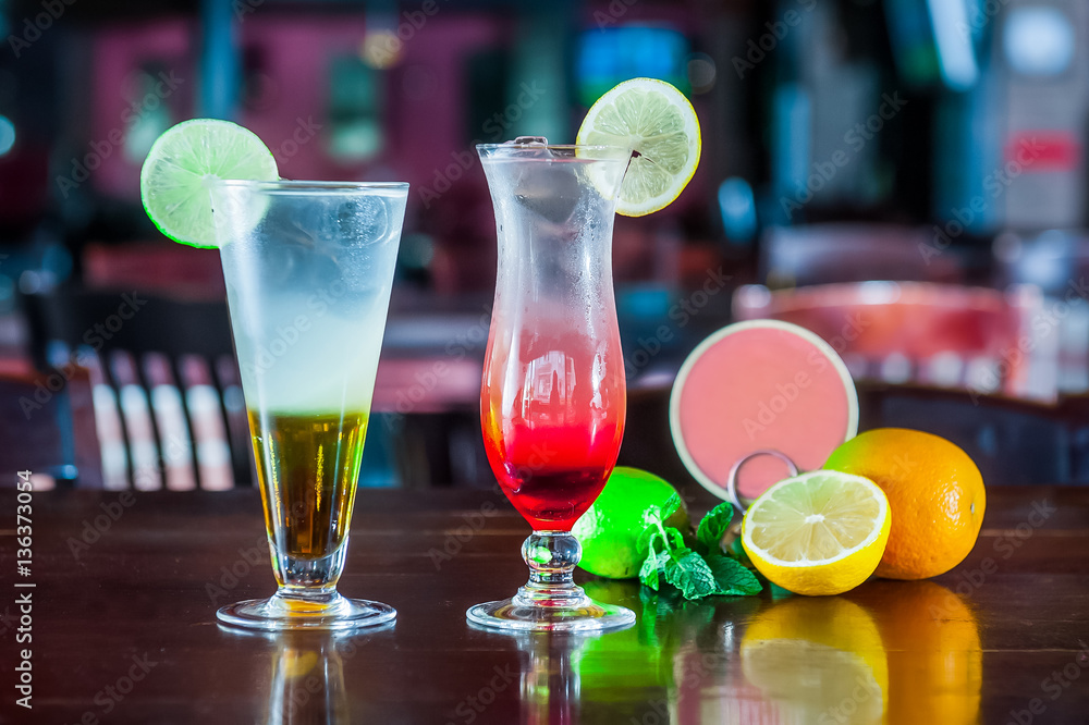 Alcohol bar, cocktail glass on bar counter, cocktail glass in a bar, Drinking cocktails, Fresh drink coctail on a color background Alcohol bar, cocktail glass on bar counter, cocktail glass in a bar, Drinking cocktails, Fresh drink coctail on a color background