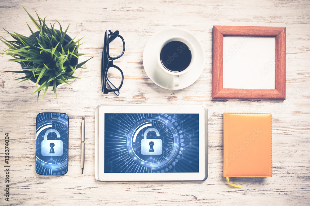 Web security and technology concept with tablet pc on wooden tab Web security and technology concept with tablet pc on wooden tab