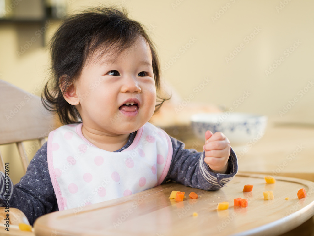 baby girl eating vegetable first time at home baby girl eating vegetable first time at home