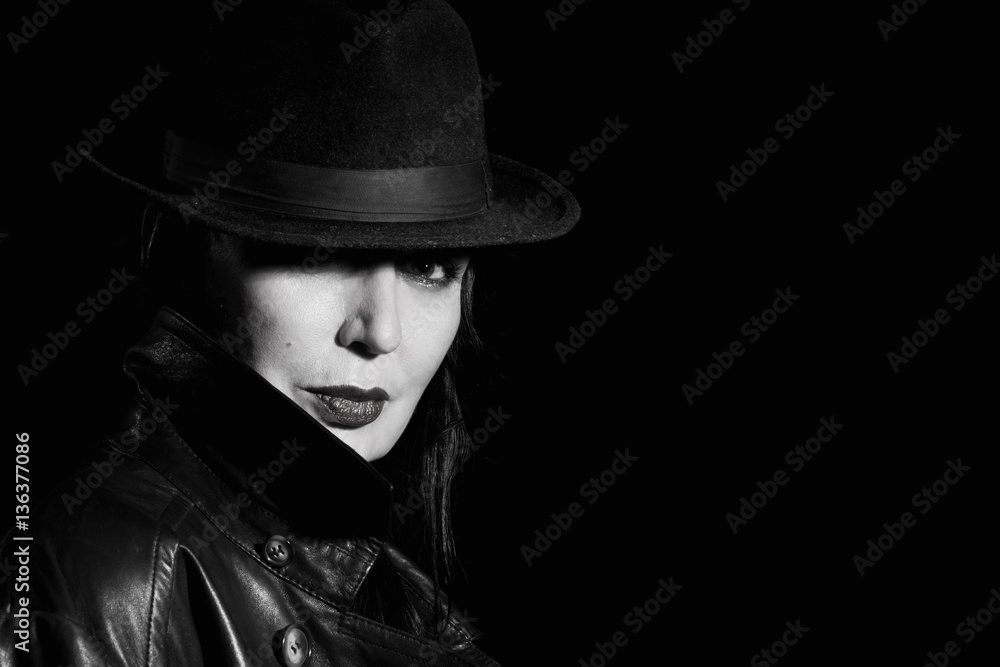 Elegant fashionable woman wearing black coat and hat Elegant fashionable woman wearing black coat and hat