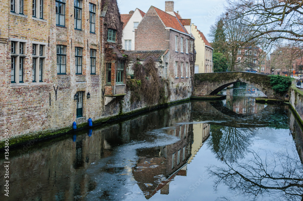 Reflections in the canal in Bruges, Belgium