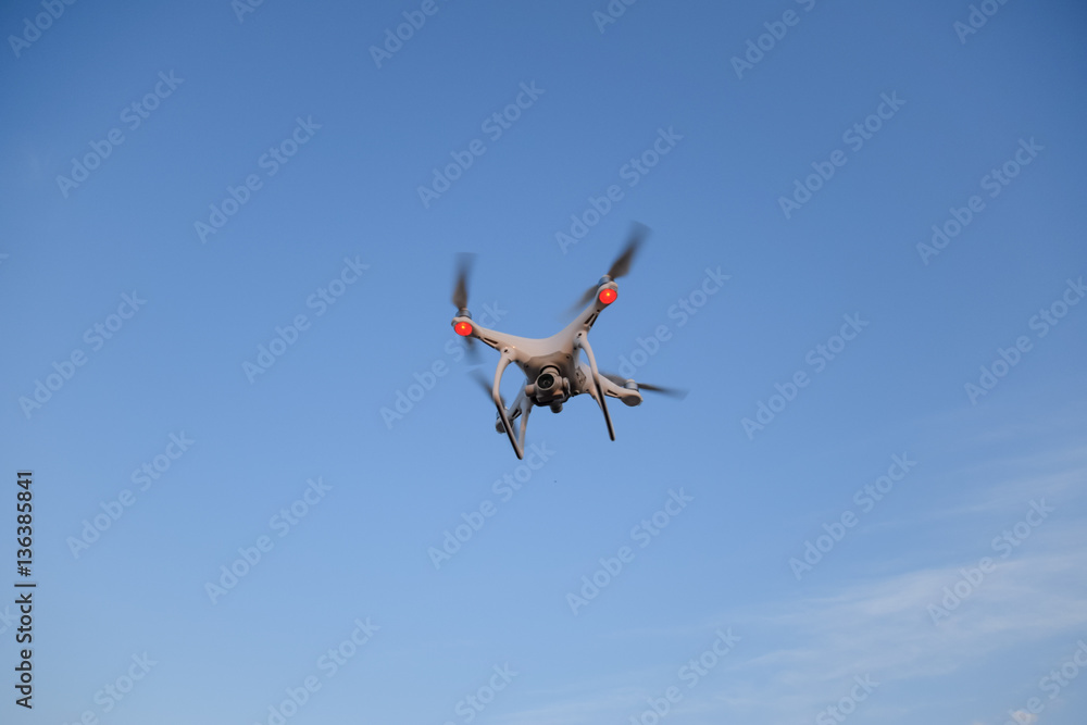 The drone, hovering in the sky. Flight quadrocopters The drone, hovering in the sky. Flight quadrocopters