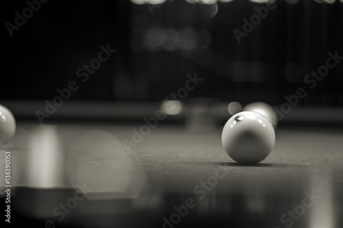 Black and white image of ball on snooker table.