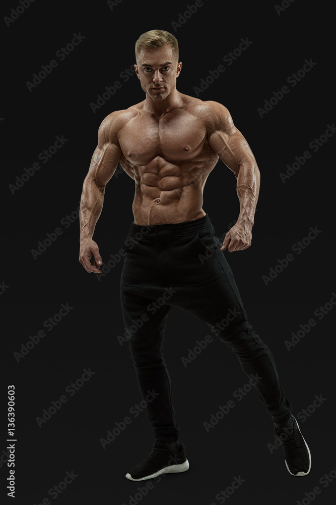 Shirtless male model posing muscular core Shirtless male model posing muscular core