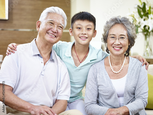 portrait asian grandparents and grandchild