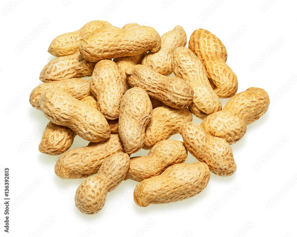 Pile of dry roasted peanuts isolated on white background. Closeup. Pile of dry roasted peanuts isolated on white background. Closeup.