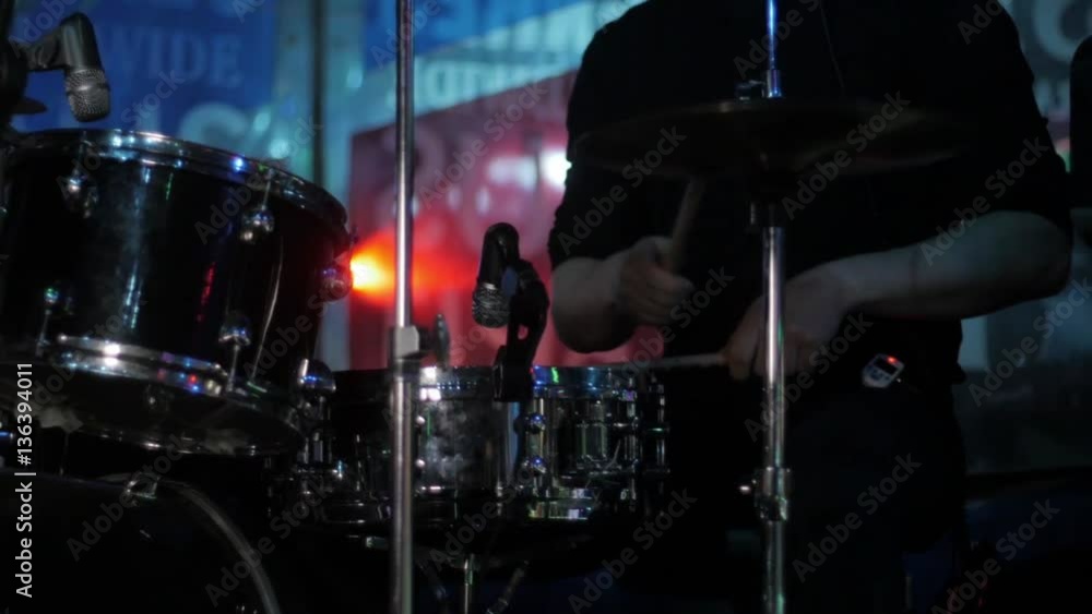 Drummer playing the drums in the background Drummer playing the drums in the background