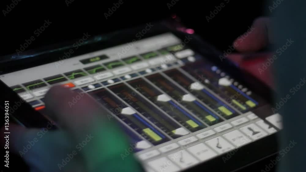 man with mixing console on tablet check sound on event, music, technology, people and equipment concept man with mixing console on tablet check sound on event, music, technology, people and equipment concept