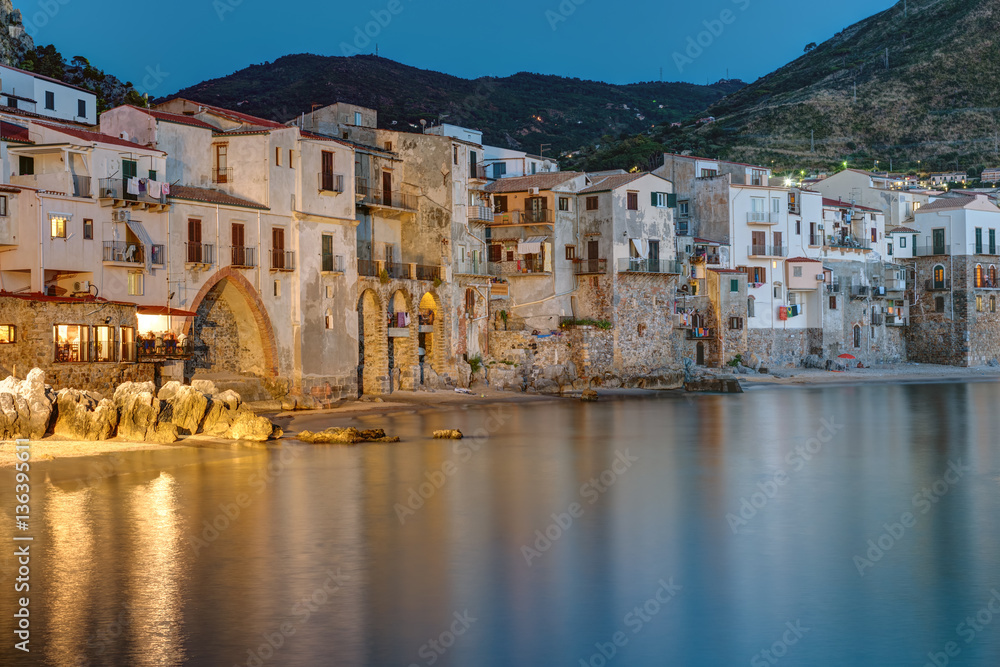 The old town of Cefalu in Sicily reaches right to the beach