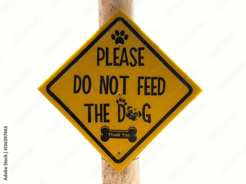 Yellow Sign Do not Feed the Dog. Signboard wildlife sign. Yellow Sign Do not Feed the Dog. Signboard wildlife sign.