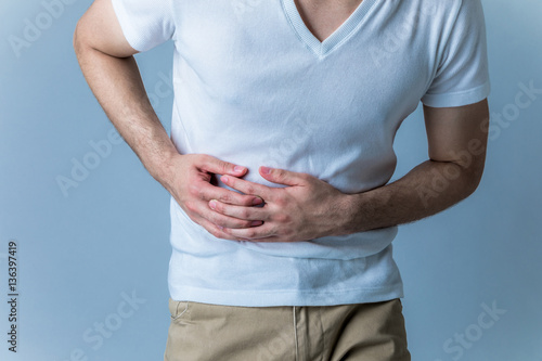 Obraz na płótnie young man having a stomachache