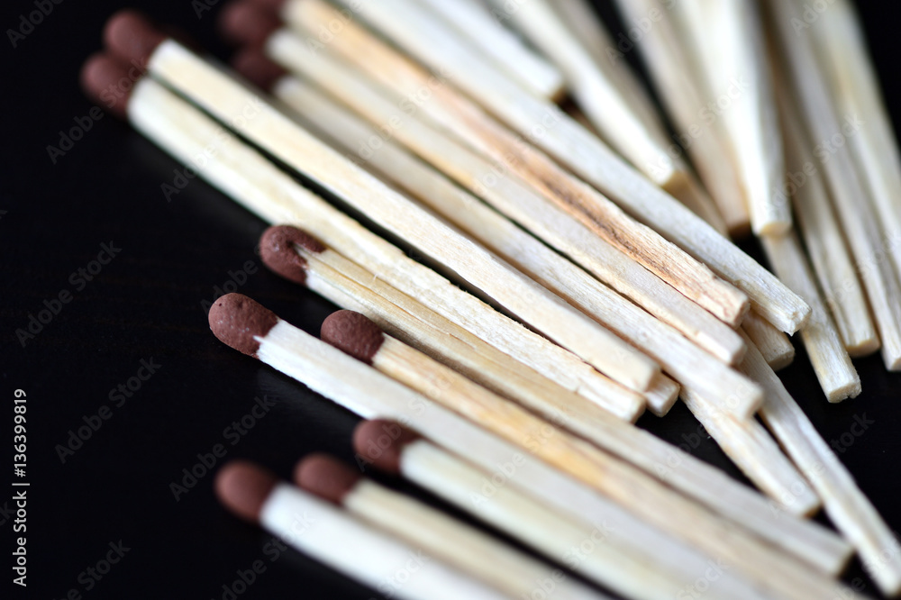 Matches scattered on a dark background close up Matches scattered on a dark background close up