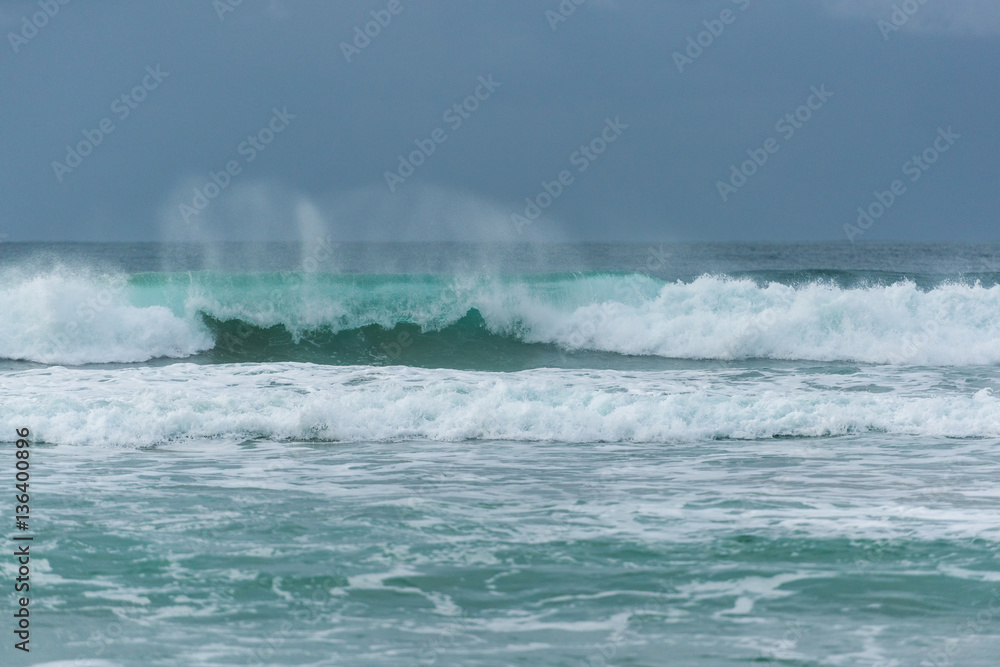 Fototapeta premium Stormy weather with high waves and grey sky