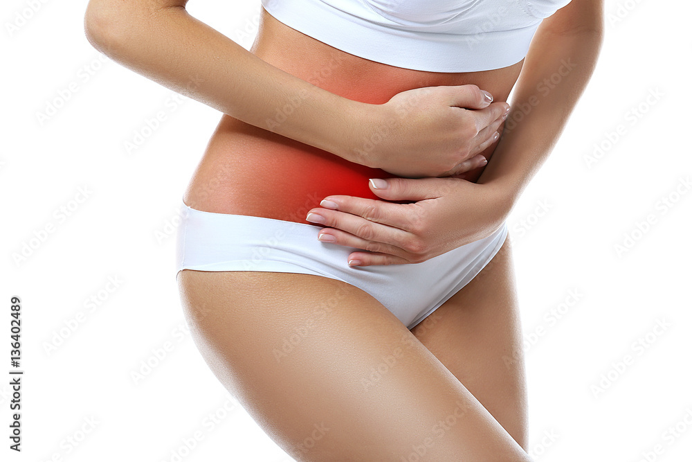 Gynecology concept. Young woman suffering from pain, white background Gynecology concept. Young woman suffering from pain, white background