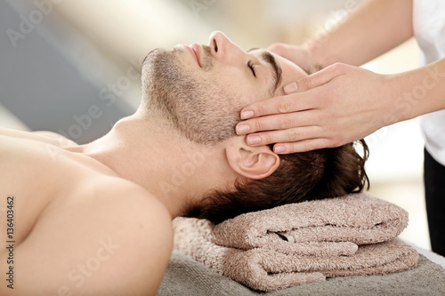 Man having face massage in ...
