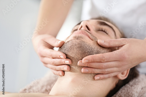 Man having face massage in ...