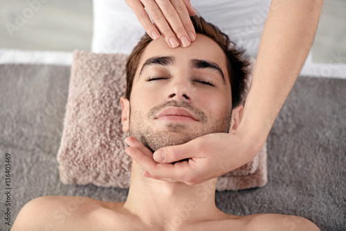 Man having face massage in ...