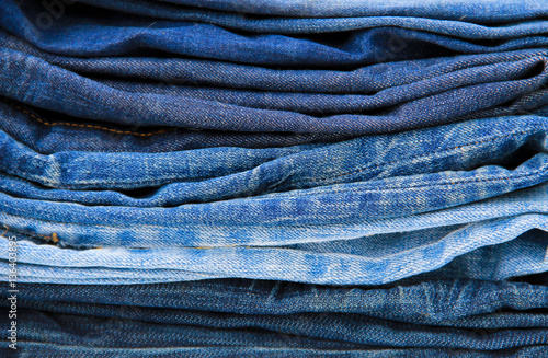 Stack of blue jeans close-up