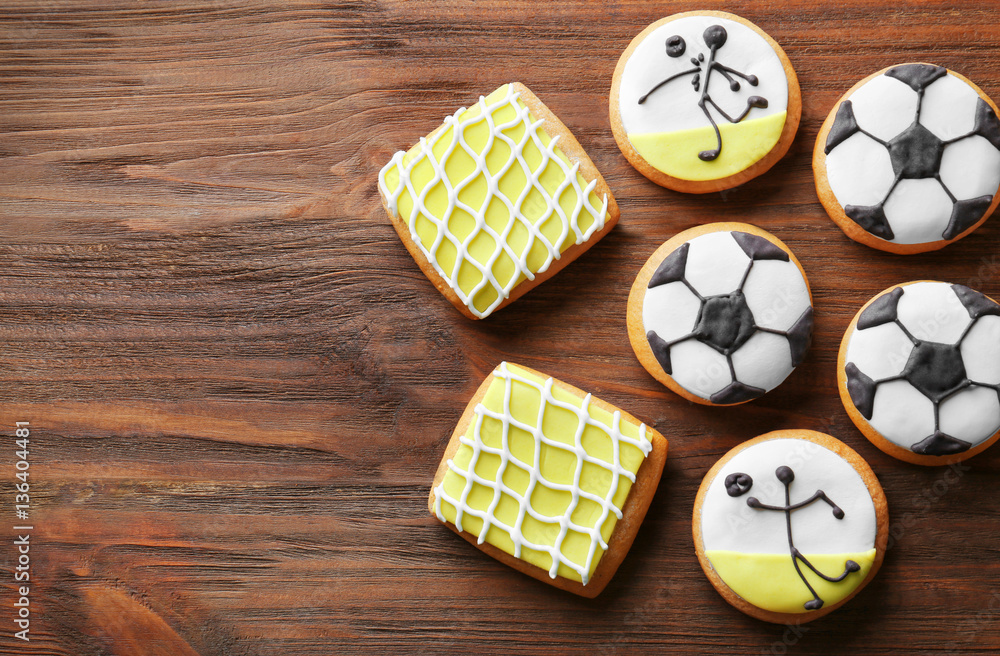Tasty football cookies on wooden background Tasty football cookies on wooden background