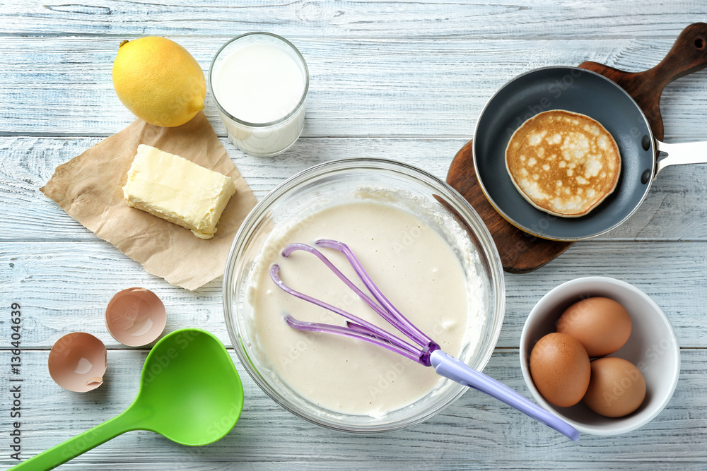Ingredients for preparation of pancakes, on wooden background Ingredients for preparation of pancakes, on wooden background
