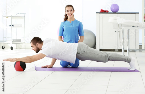 Physiotherapist working wit...