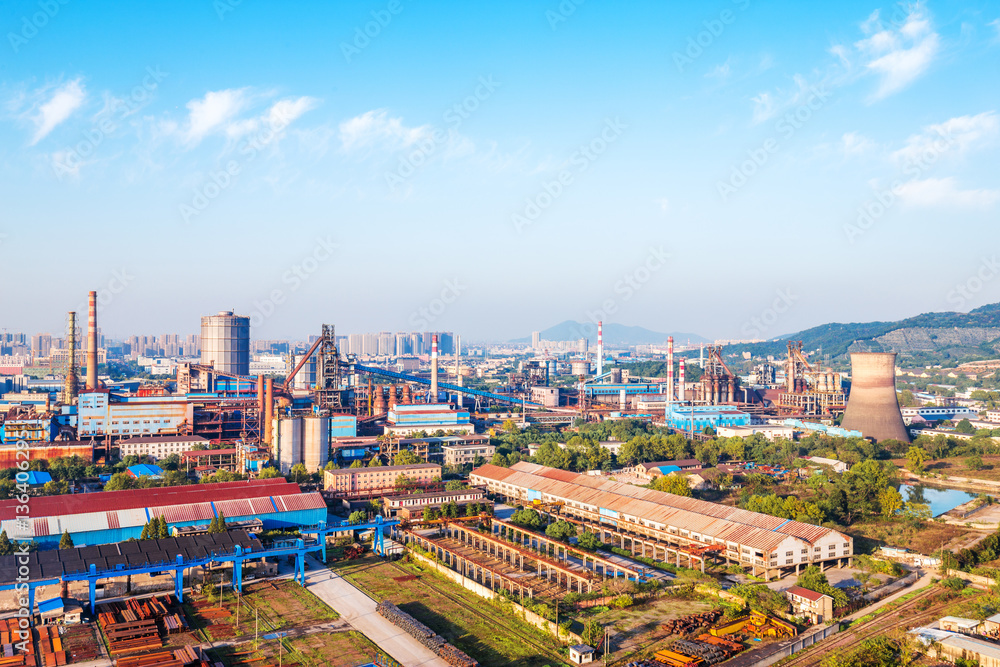 Obraz premium constructions of steel factory in blue sky
