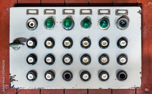 Retro control panel with buttons, colored lights and switches