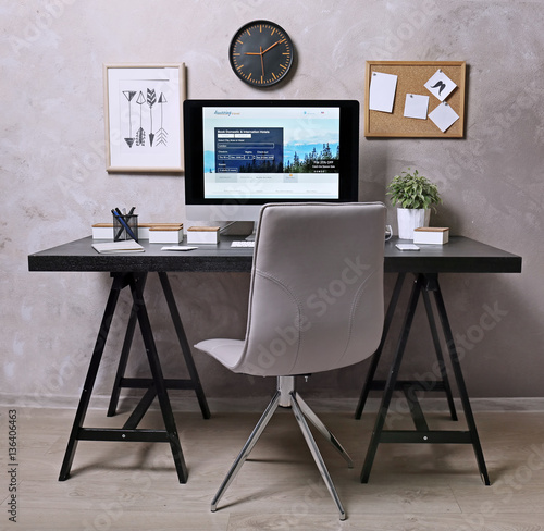 Workplace with computer on table in modern room