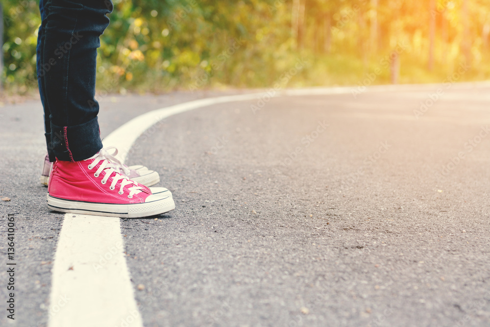 Feet Asian children on road background,Hitchhiking trip Feet Asian children on road background,Hitchhiking trip
