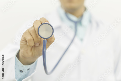 Medicine doctor show a stethoscope in the hand as medical concept, processing instagram tone color.