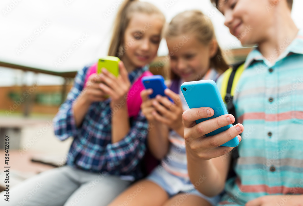elementary school students with smartphones elementary school students with smartphones