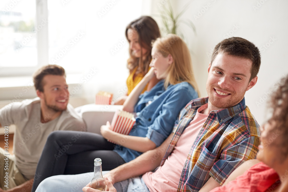 happy friends with popcorn and beer at home happy friends with popcorn and beer at home
