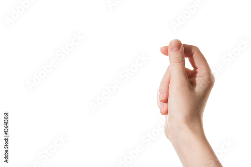 Female hand holding a virtual card with your fingers on a white background photo